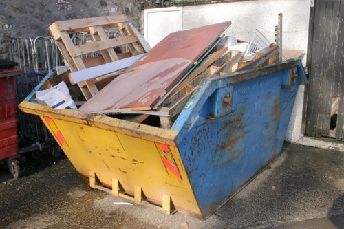 Commercial waste removal team preparing for safe collection